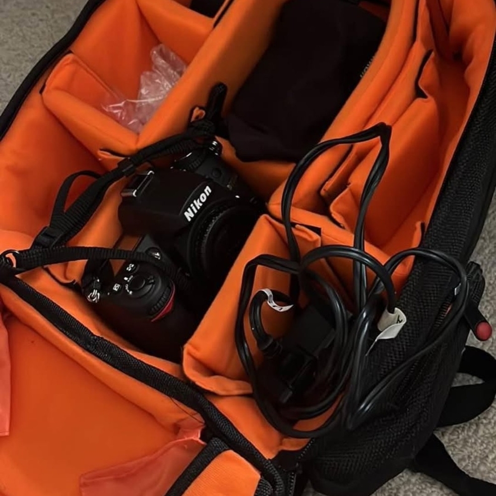 Nikon Camera with Black and Orange Bag